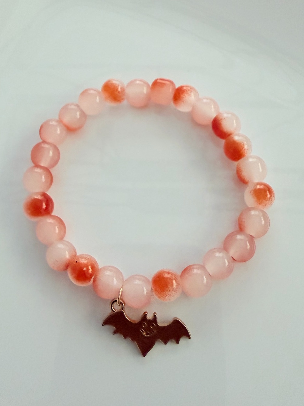 Orange Beaded Bracelet with Bat Charm